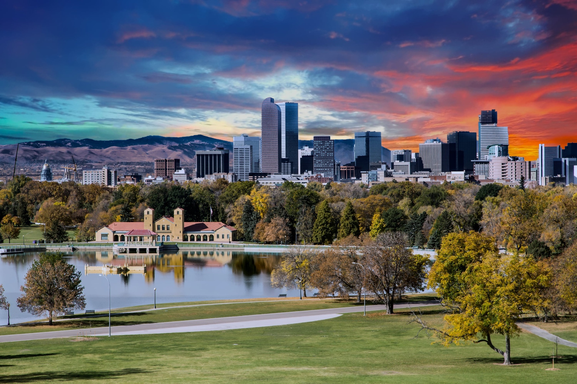 Denver skyline at sunset with City Park and the Rocky Mountains